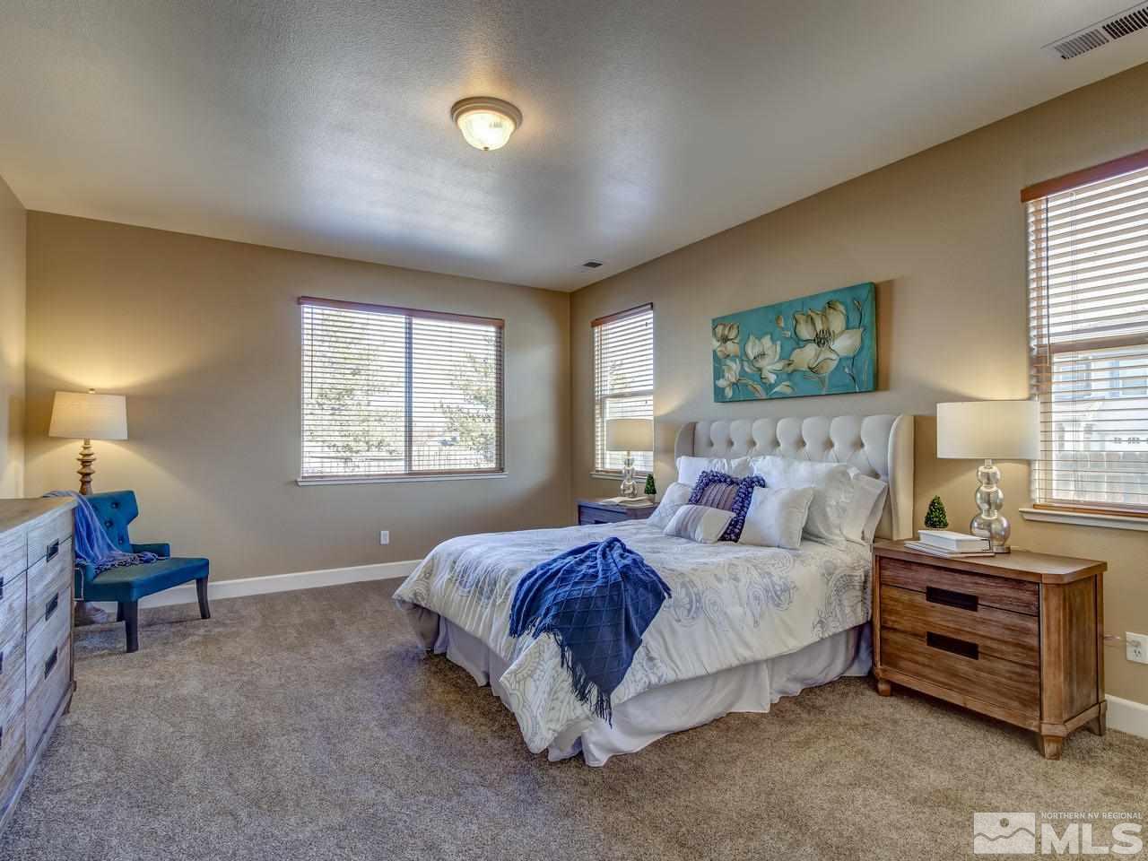 10803 Rushing Flume Drive Reno, NV 89521 - Photo 13 of 22 a bedroom with a bed and a window