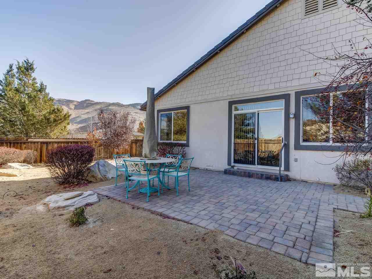 10803 Rushing Flume Drive Reno, NV 89521 - Photo 19 of 22 a view of a house with backyard porch and sitting area