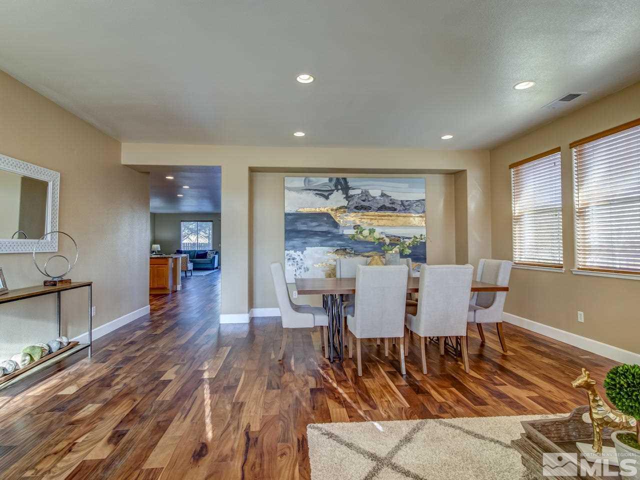 10803 Rushing Flume Drive Reno, NV 89521 - Photo 3 of 22 a view of a dining room with furniture window and wooden floor