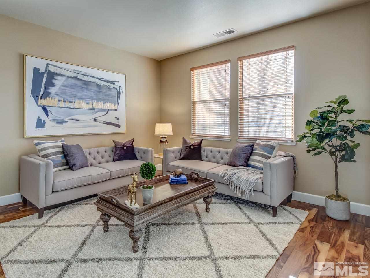 10803 Rushing Flume Drive Reno, NV 89521 - Photo 5 of 22 a living room with furniture and a potted plant