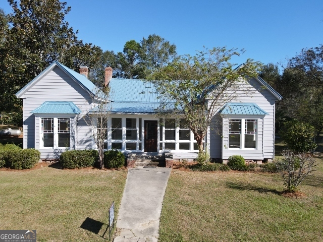 405 Monroe Street Garfield, GA 30425 - Photo 2 of 30 front view of a house with a yard