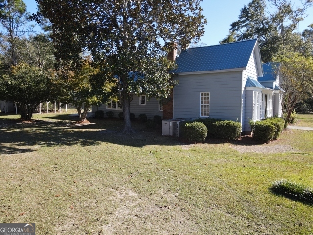 405 Monroe Street Garfield, GA 30425 - Photo 24 of 30 a front view of a house with a yard