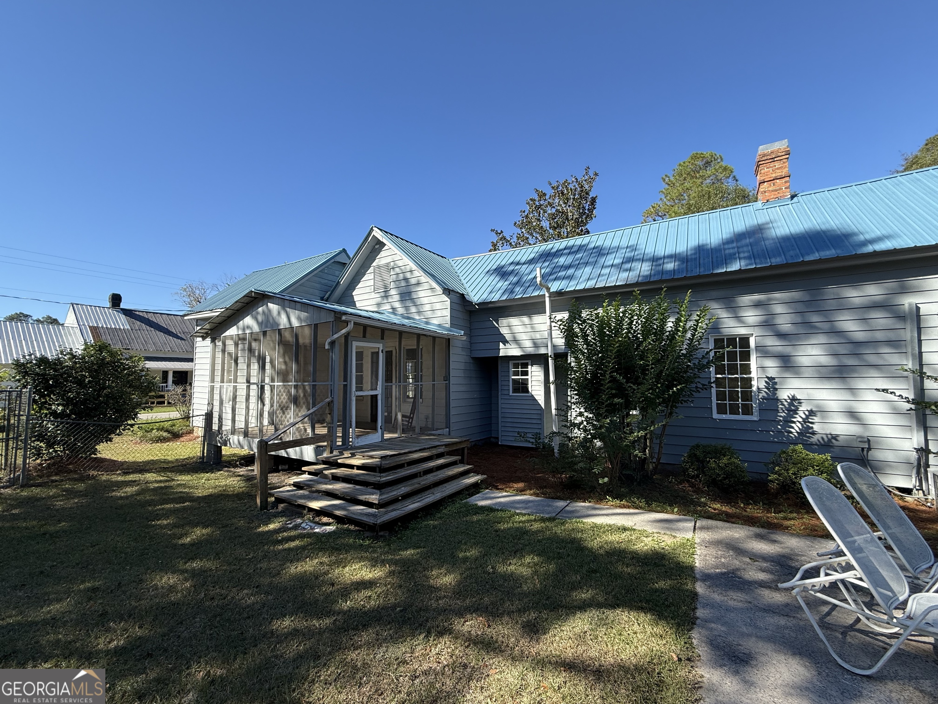 405 Monroe Street Garfield, GA 30425 - Photo 25 of 30 a front view of a house with garden