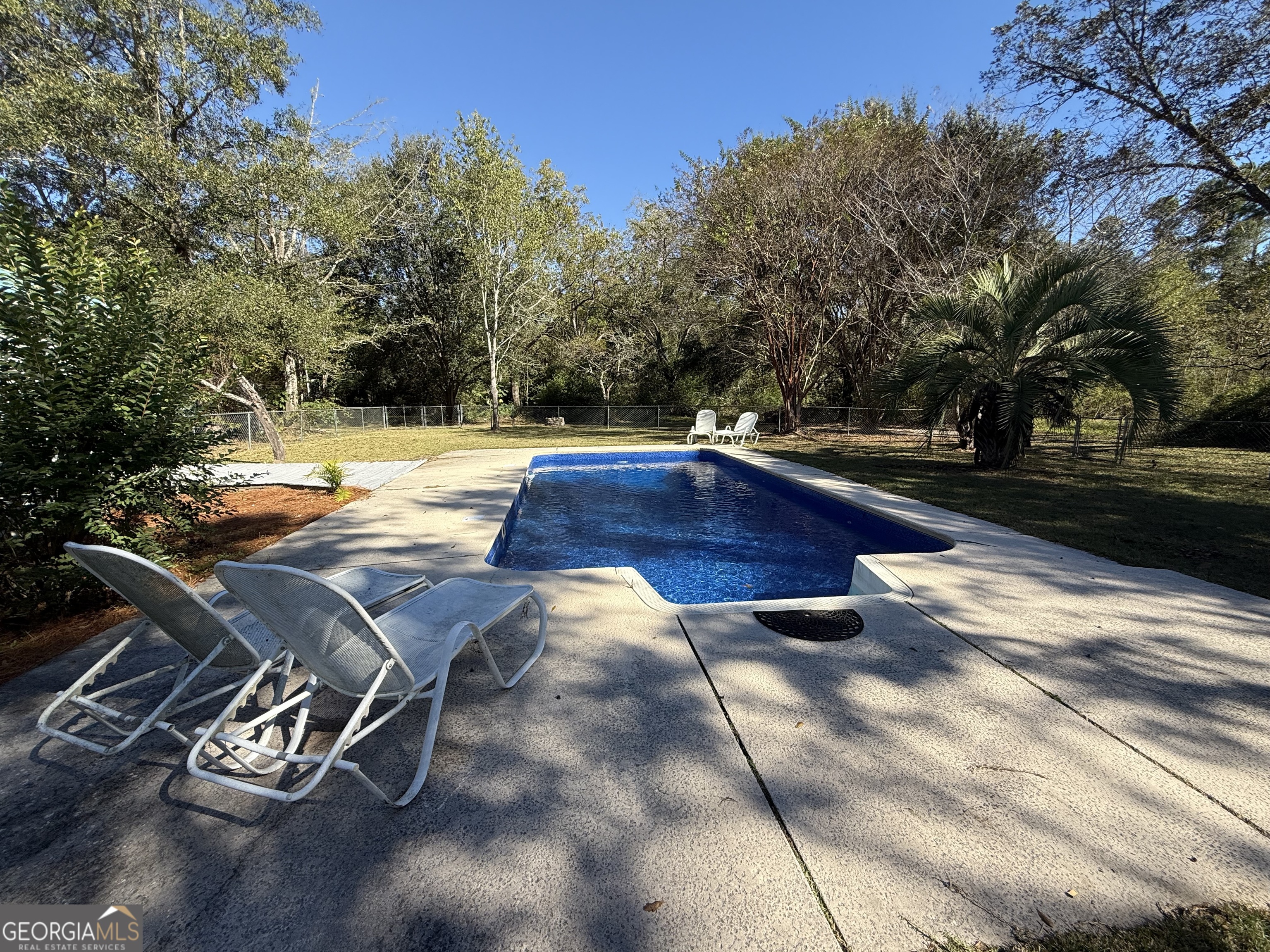 405 Monroe Street Garfield, GA 30425 - Photo 26 of 30 a view of swimming pool with chairs