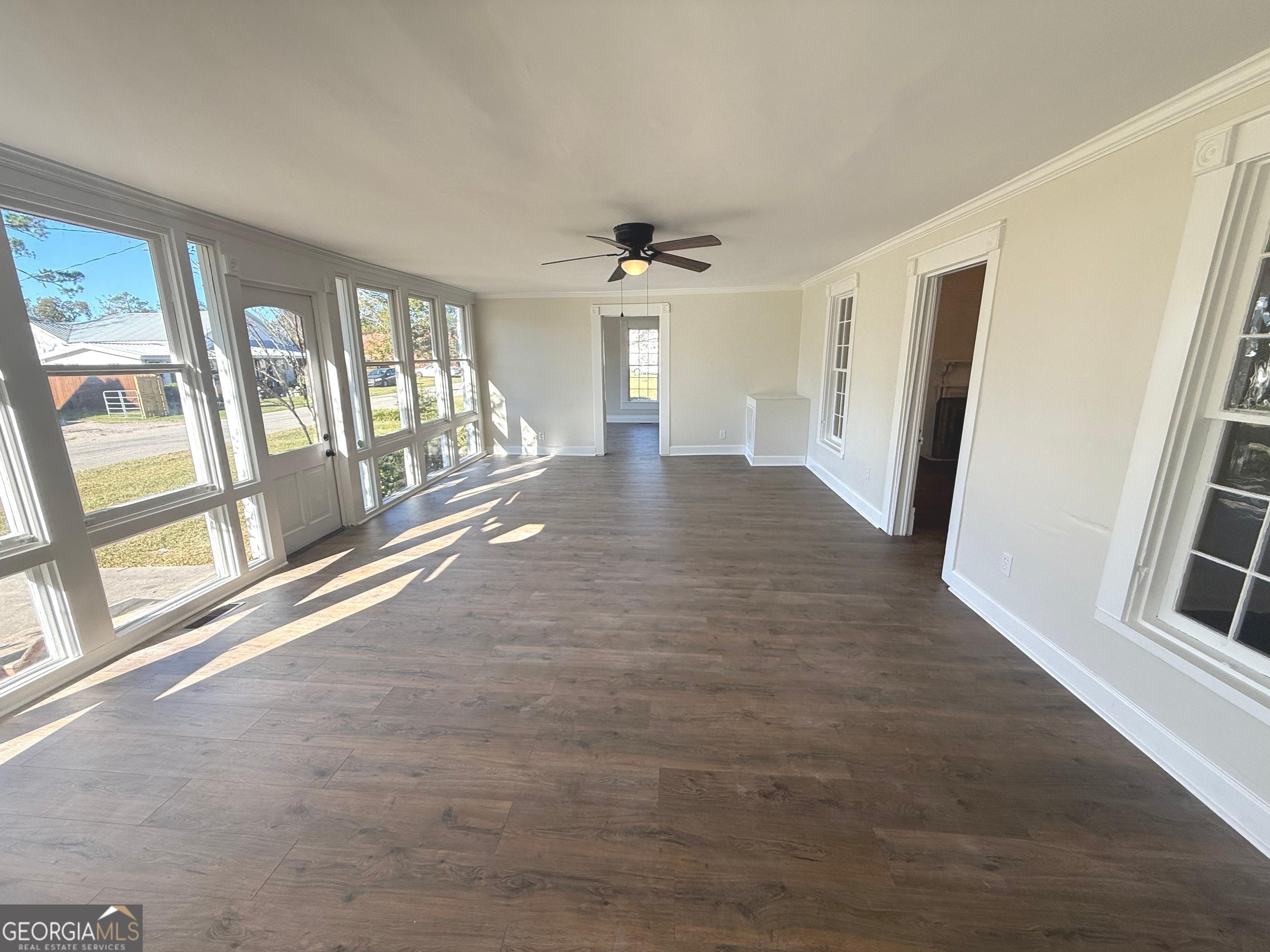 405 Monroe Street Garfield, GA 30425 - Photo 5 of 30 wooden floor in an empty room with a window