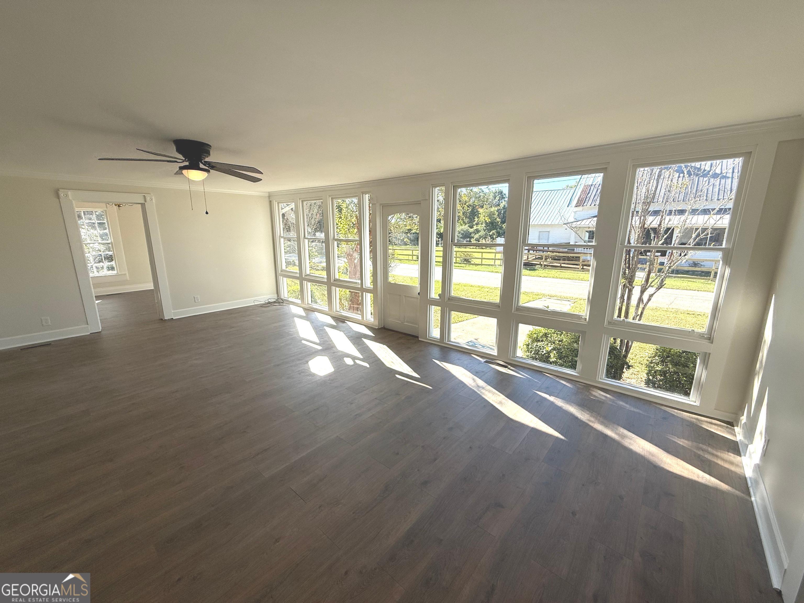 405 Monroe Street Garfield, GA 30425 - Photo 6 of 30 a view of an empty room with a window