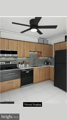 a kitchen with stainless steel appliances granite countertop a refrigerator a sink and a stove