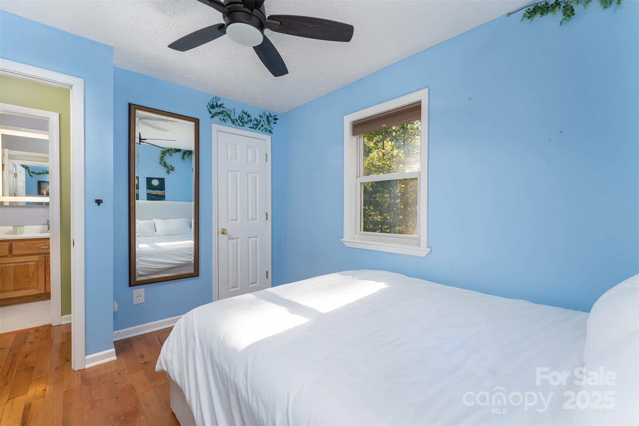 141 Willets Point Boulevard Nebo, NC 28761 - Photo 13 of 29 a bedroom with a bed and a window