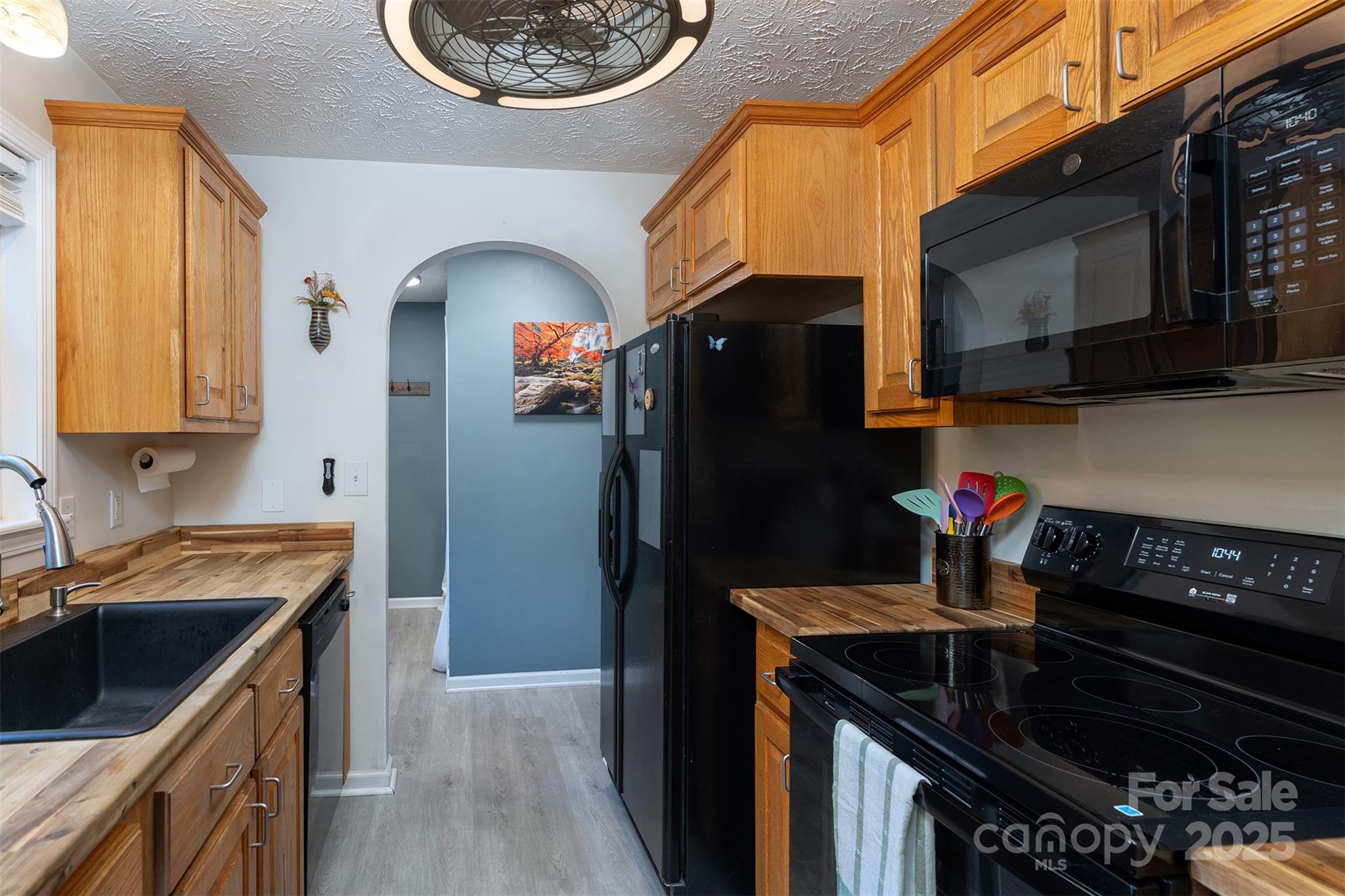 141 Willets Point Boulevard Nebo, NC 28761 - Photo 15 of 29 a kitchen with stainless steel appliances granite countertop a stove a sink and a refrigerator