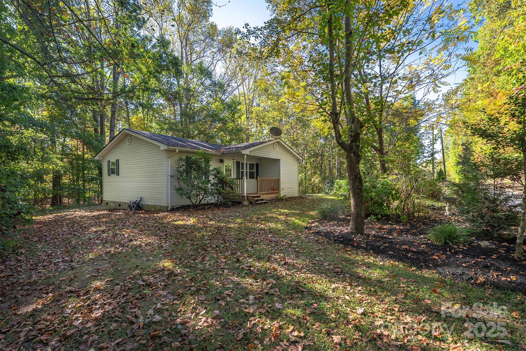 141 Willets Point Boulevard Nebo, NC 28761 - Photo 19 of 29 a house with a tree in front of it