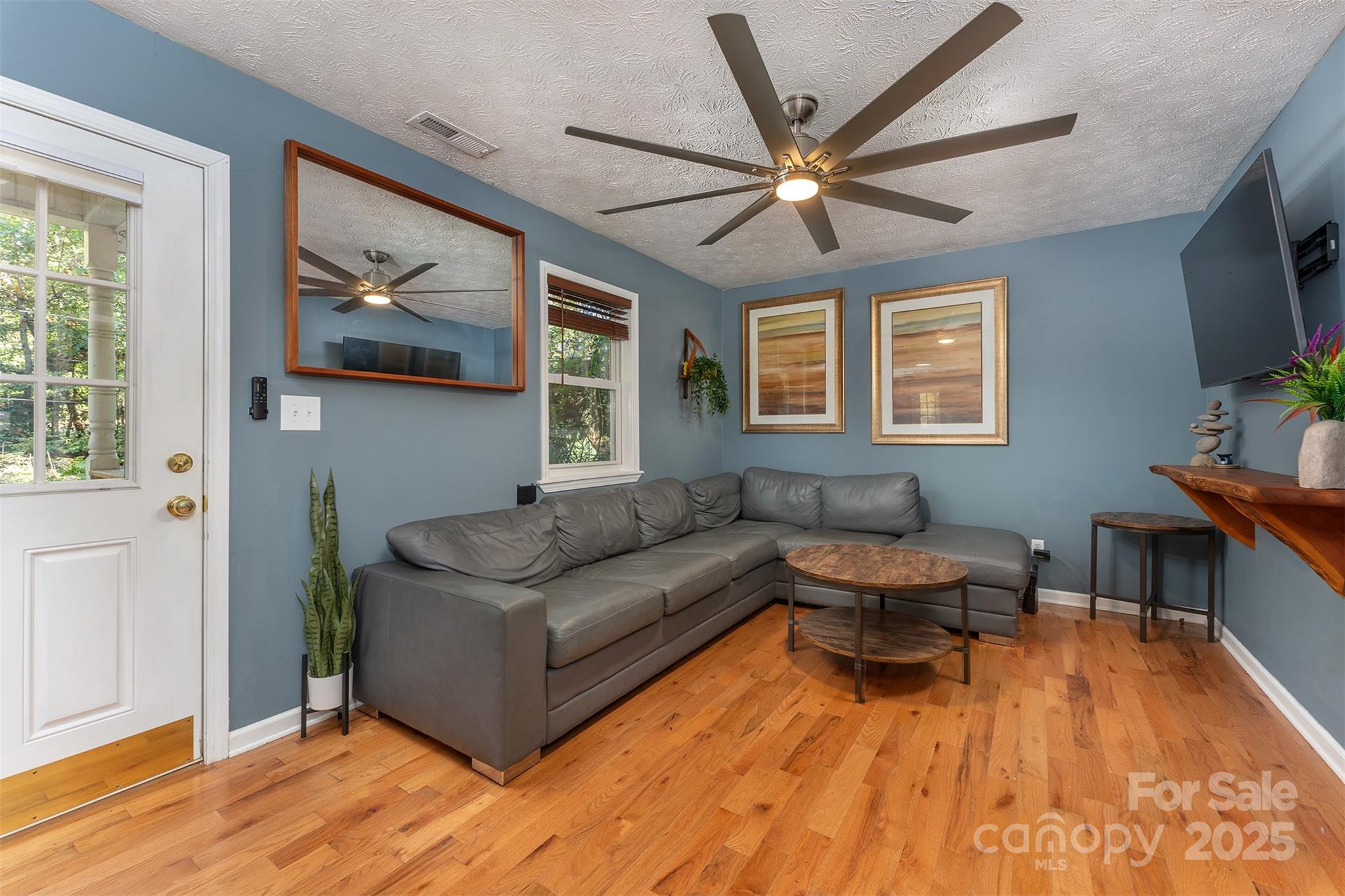 141 Willets Point Boulevard Nebo, NC 28761 - Photo 8 of 29 a living room with furniture and a wooden floor
