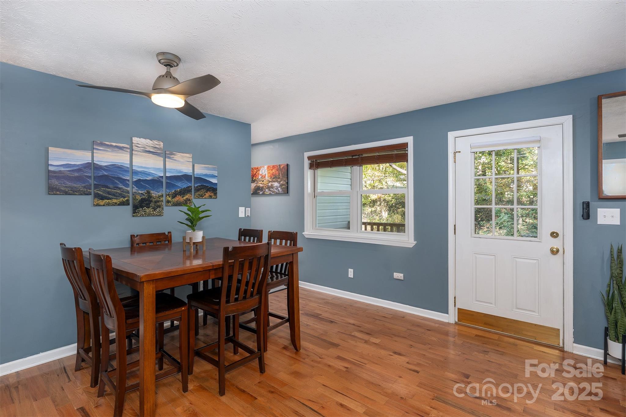 141 Willets Point Boulevard Nebo, NC 28761 - Photo 10 of 29 a view of a dining room with furniture window and wooden floor