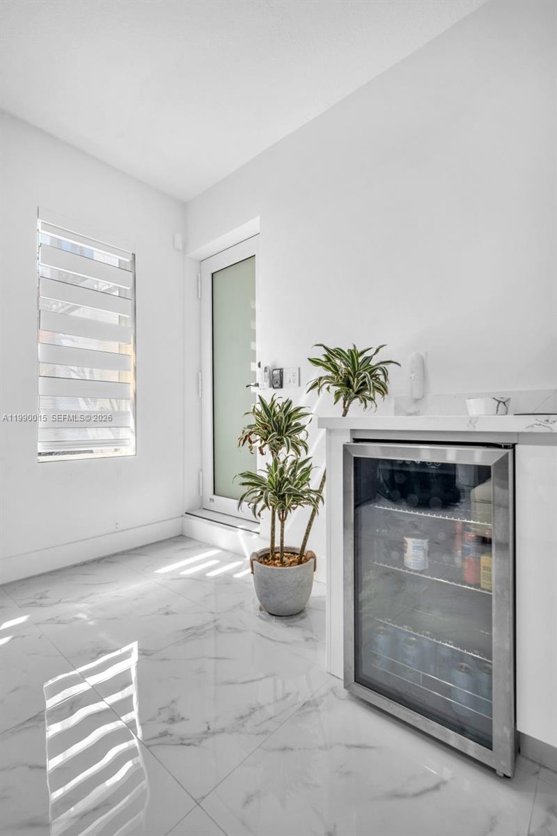 15965 Southwest 98th Street Miami, FL 33196 - Photo 24 of 53 flex room with built in cabinets and beverage/wine cooler
