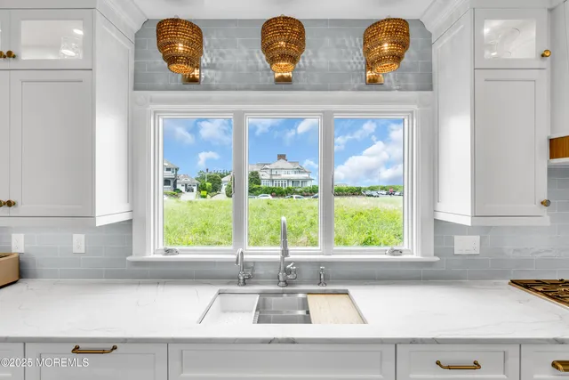 a large kitchen with a table and chairs