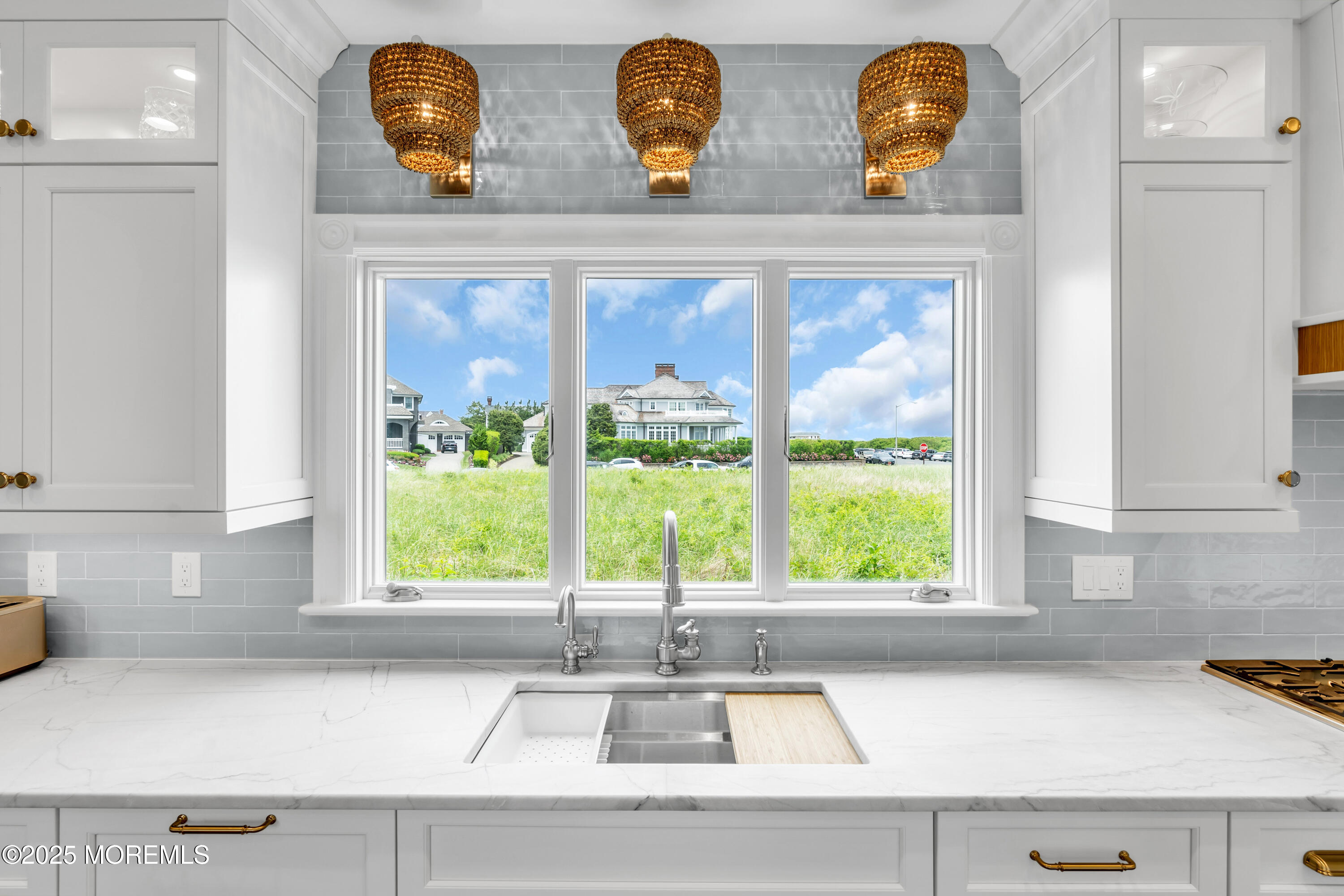 1612 Ocean Avenue Spring Lake, NJ 07762 - Photo 12 of 61 a kitchen with a sink and a large window