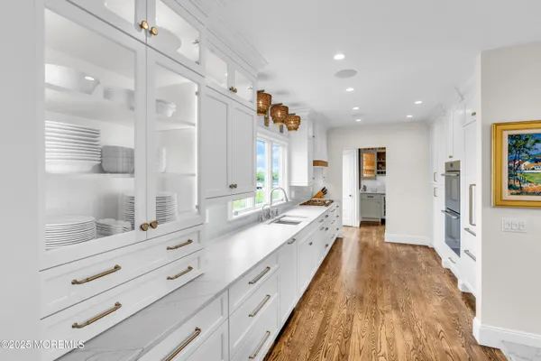a dining room with furniture a window and kitchen view
