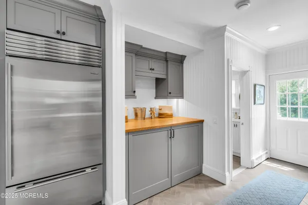 a kitchen with stainless steel appliances granite countertop a sink and cabinets