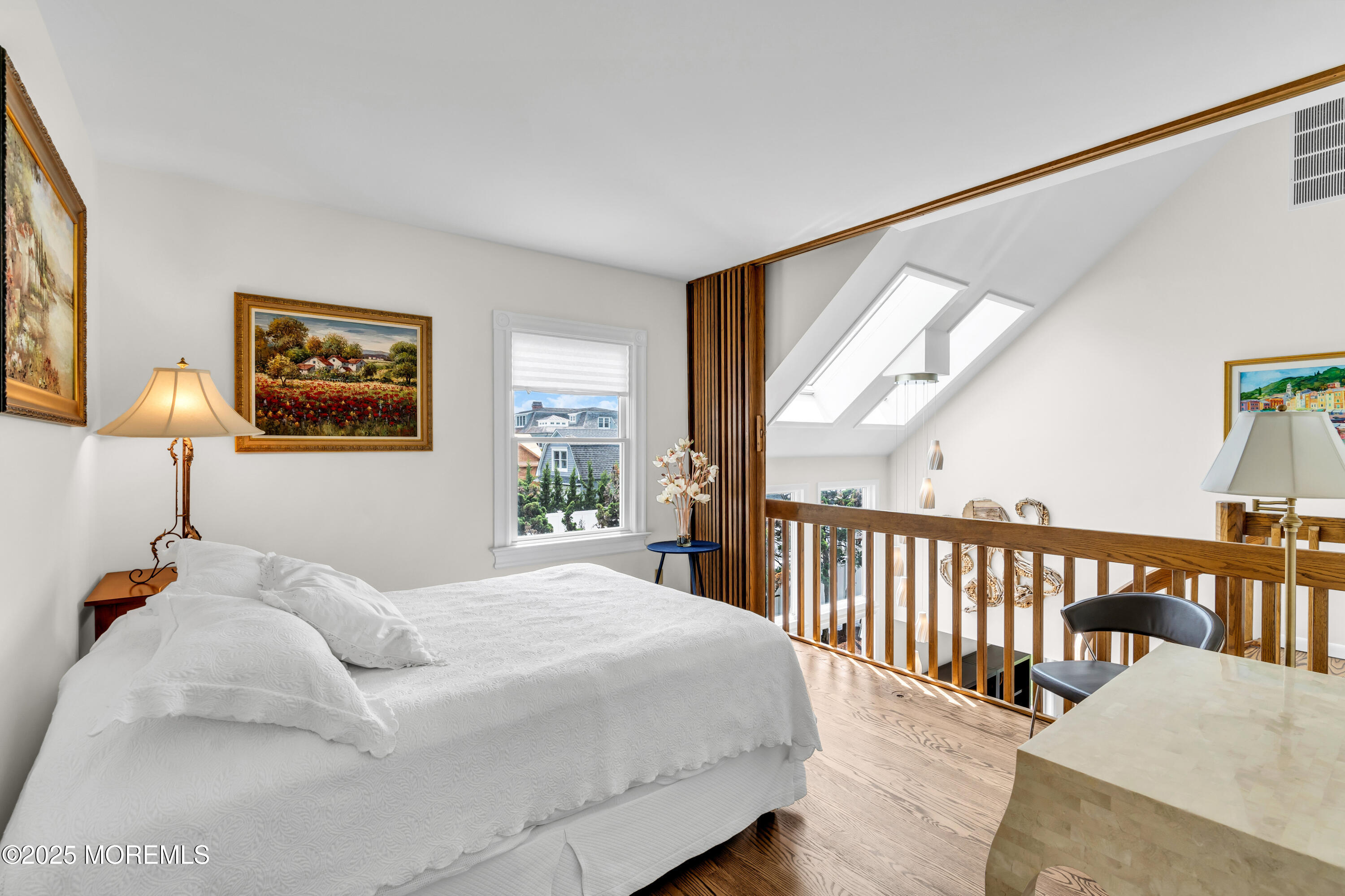 1612 Ocean Avenue Spring Lake, NJ 07762 - Photo 28 of 61 a bedroom with a bed and a large window