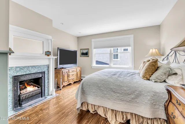 a living room with furniture a large window and a flat screen tv