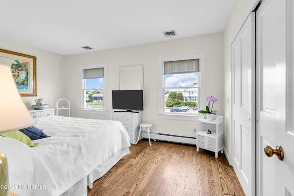 a bed room with a bed and a television