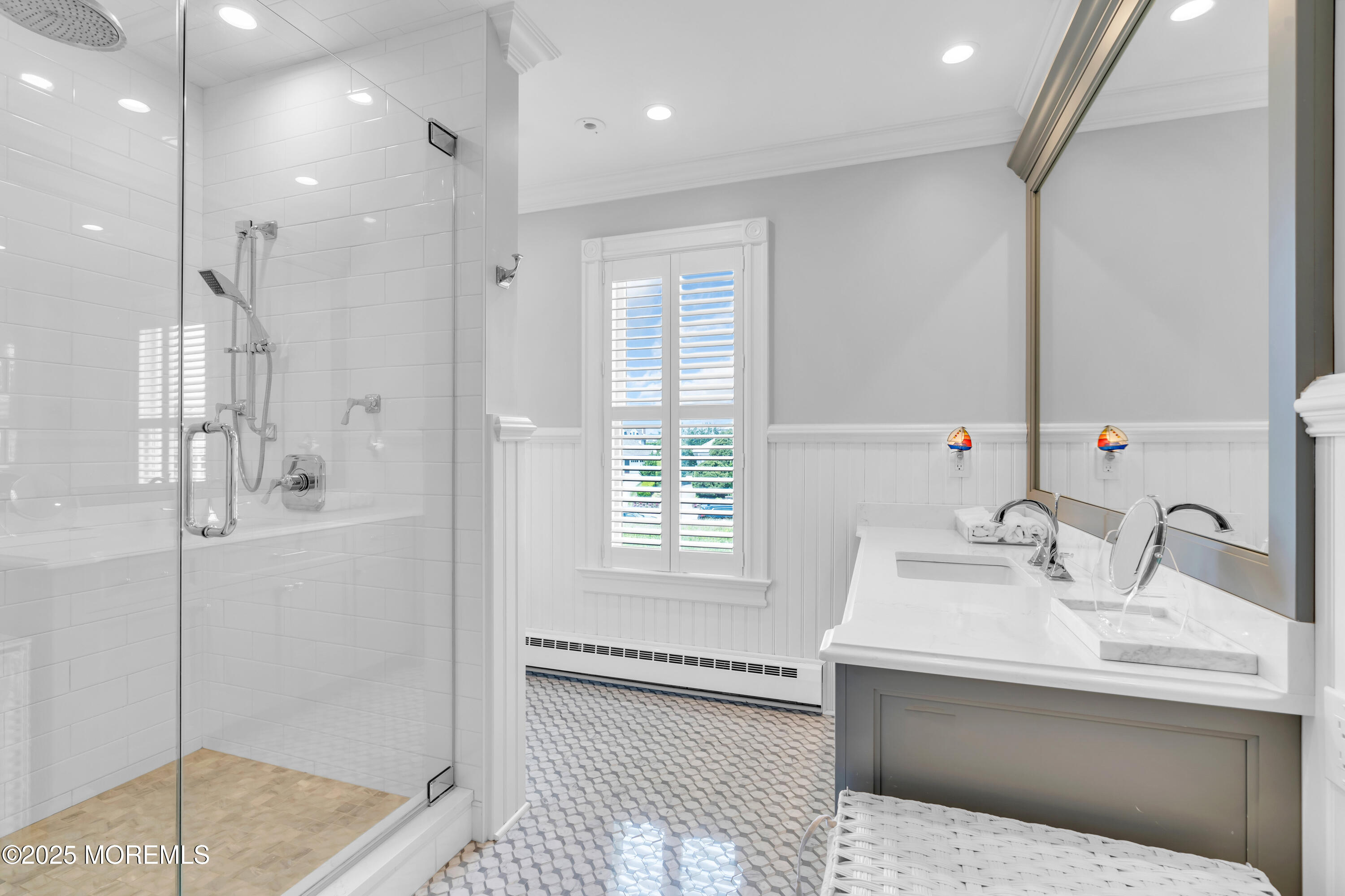 1612 Ocean Avenue Spring Lake, NJ 07762 - Photo 32 of 61 a bathroom with a sink and a mirror