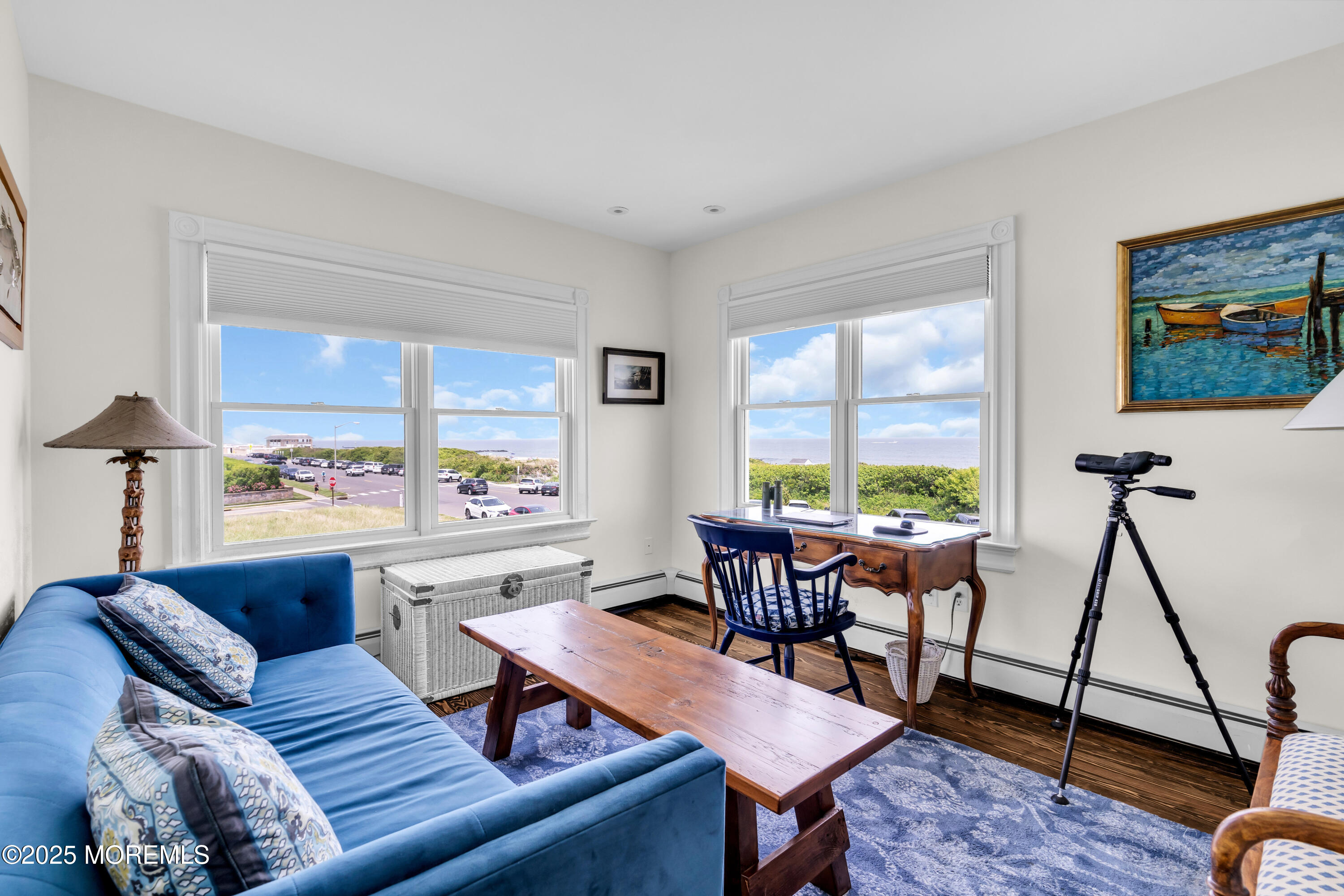 1612 Ocean Avenue Spring Lake, NJ 07762 - Photo 37 of 61 a living room with furniture a large window and a flat screen tv