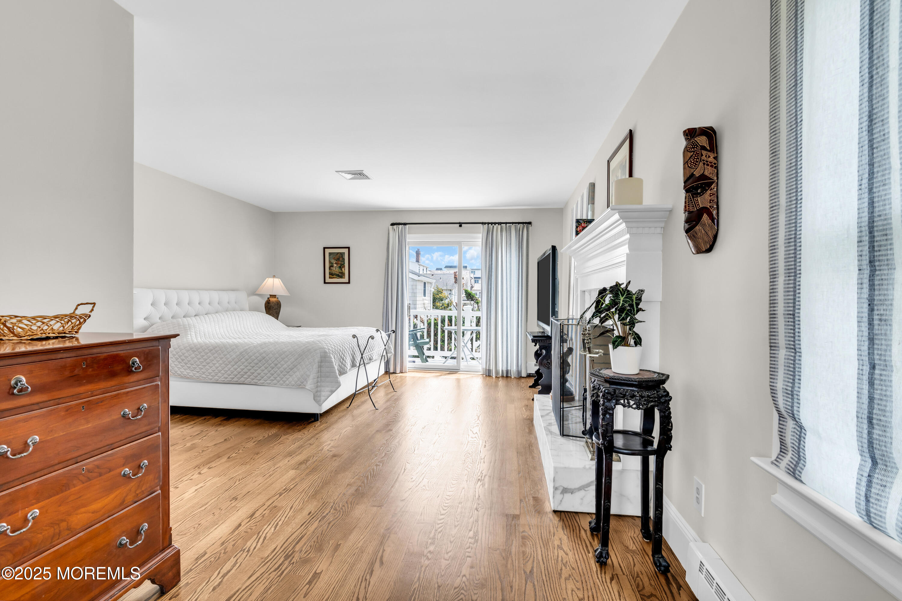 1612 Ocean Avenue Spring Lake, NJ 07762 - Photo 39 of 61 a bedroom with furniture and a wooden floor