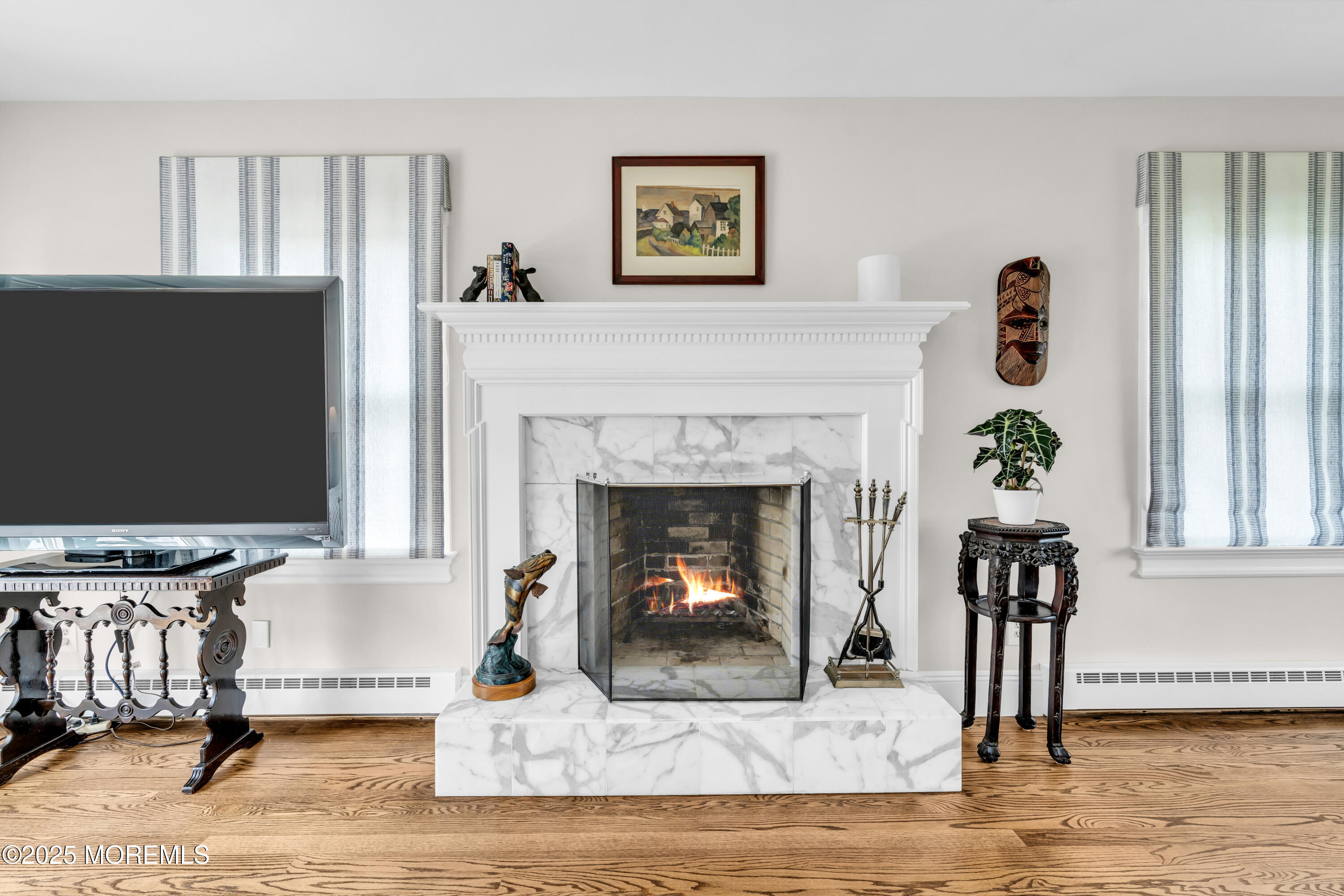 1612 Ocean Avenue Spring Lake, NJ 07762 - Photo 42 of 61 a living room with furniture and a fireplace