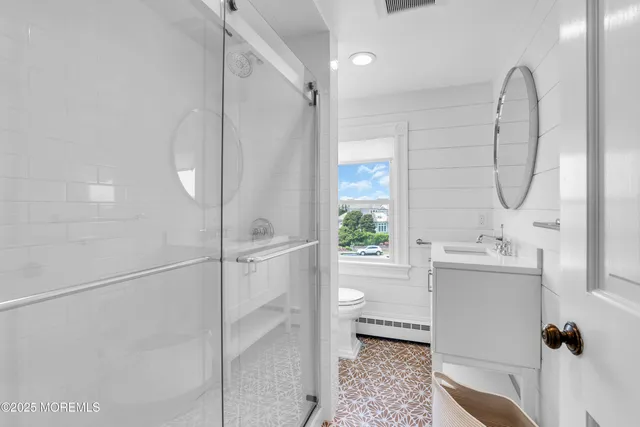 a kitchen with kitchen island granite countertop a stove and a sink