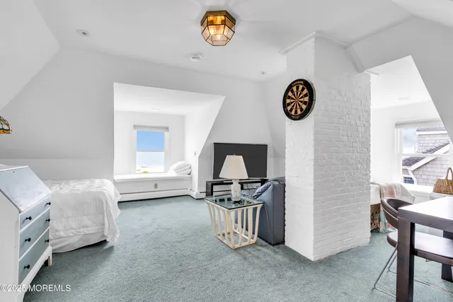 a bedroom with a bed and a fireplace