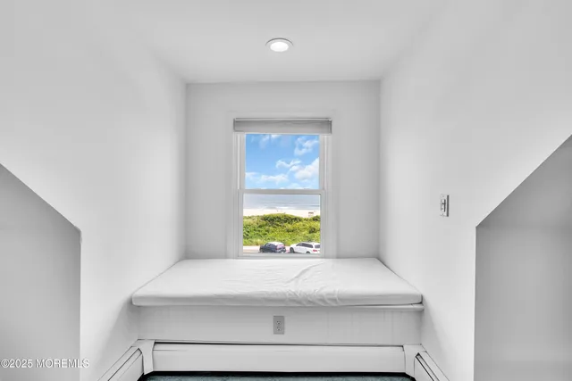 a bedroom with a bed and a fireplace