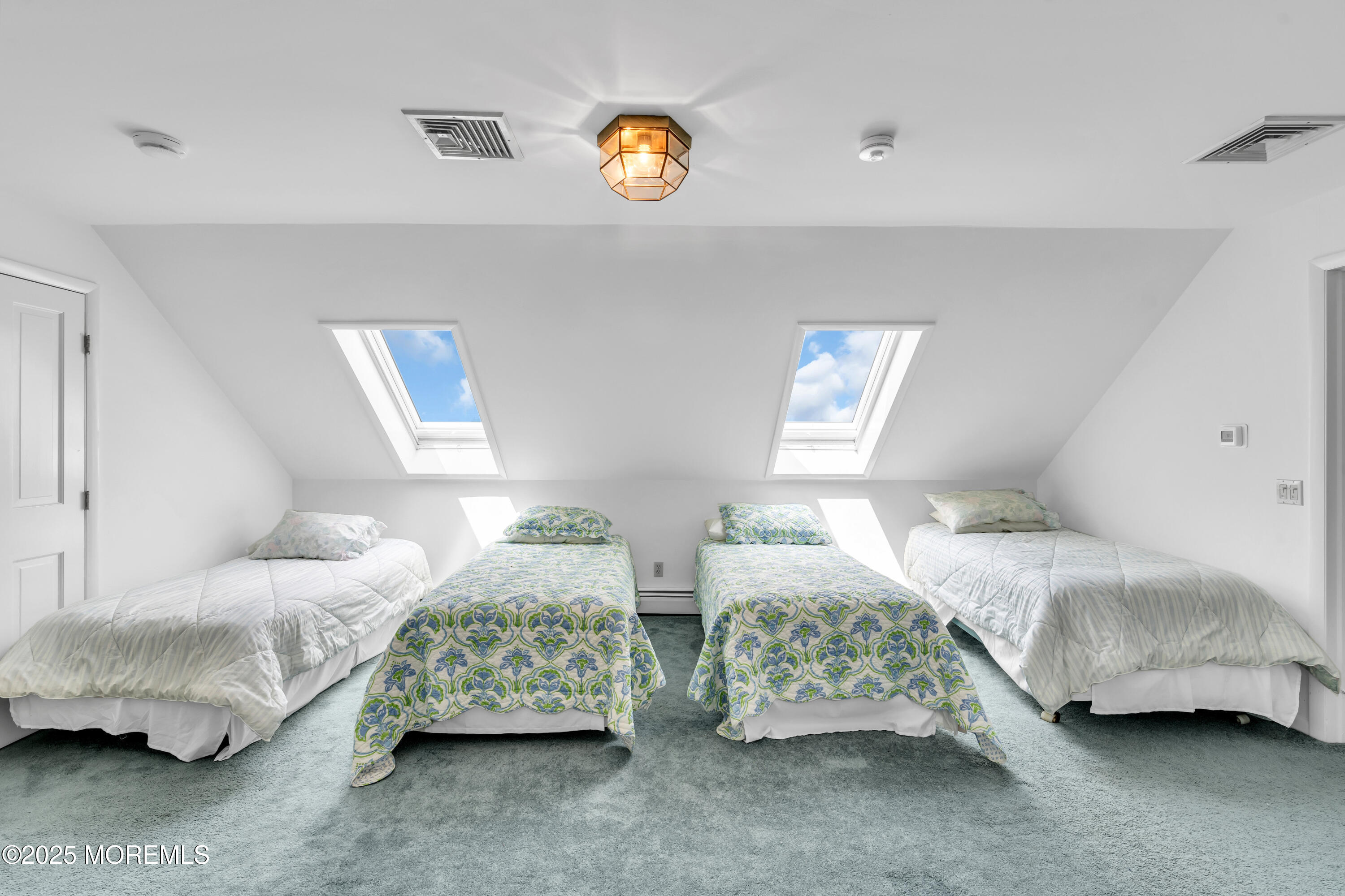 1612 Ocean Avenue Spring Lake, NJ 07762 - Photo 51 of 61 a bedroom with two beds and painting on the wall