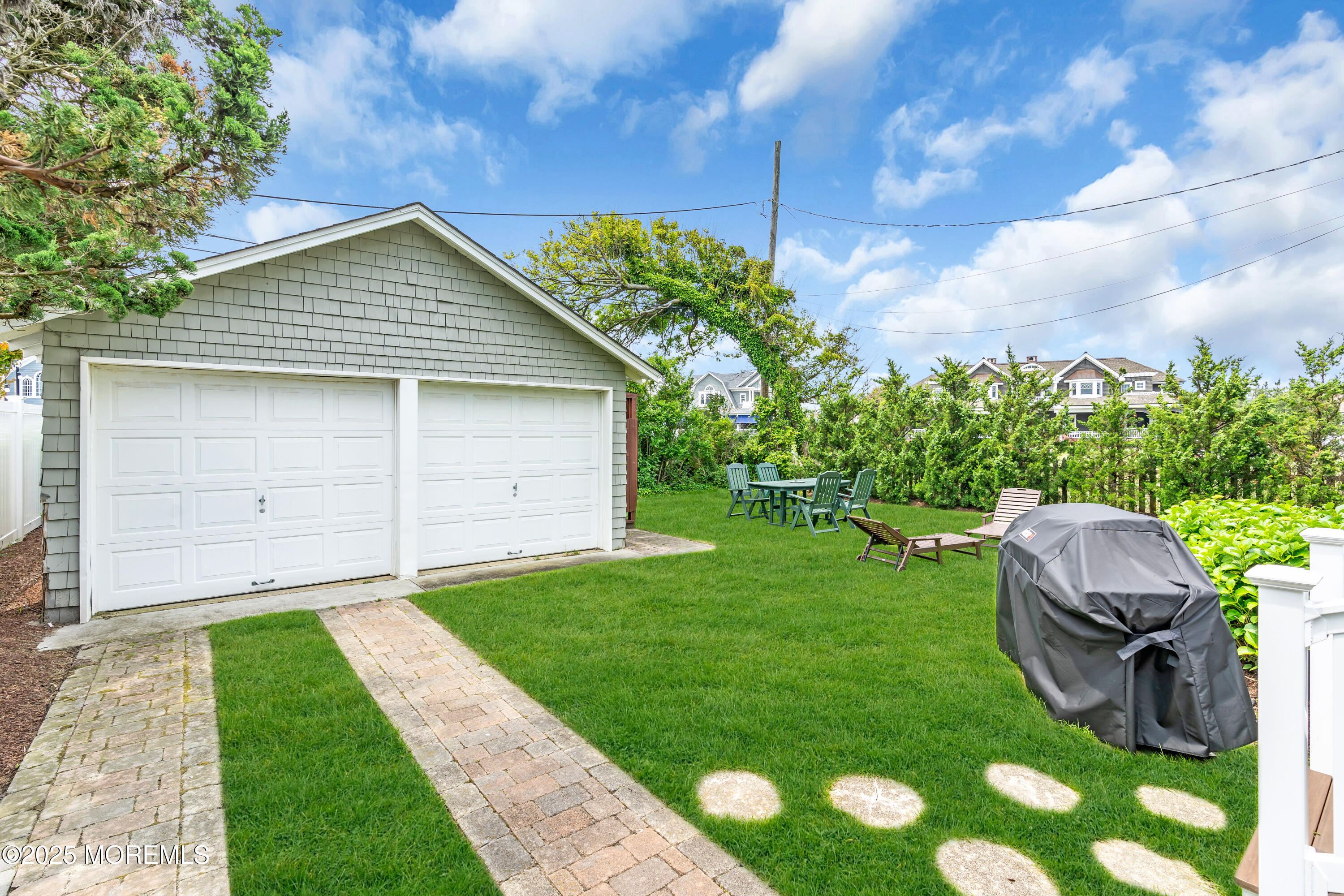 1612 Ocean Avenue Spring Lake, NJ 07762 - Photo 55 of 61 a backyard of a house with seating space