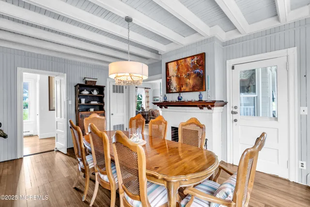 a large kitchen with stainless steel appliances a large counter top a stove and a refrigerator