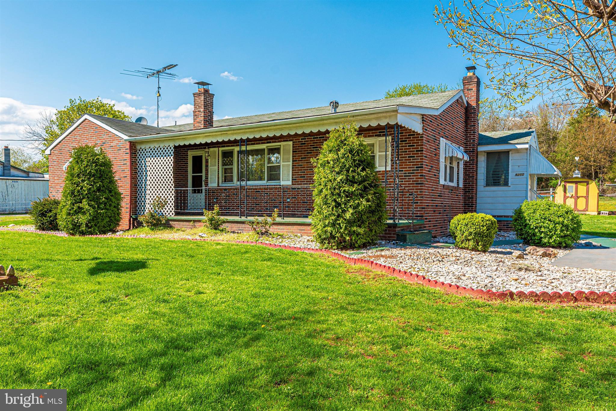 9250 Rocky Ridge Road Rocky Ridge, MD 21778 - Photo 1 of 67 a front view of house with yard and outdoor seating