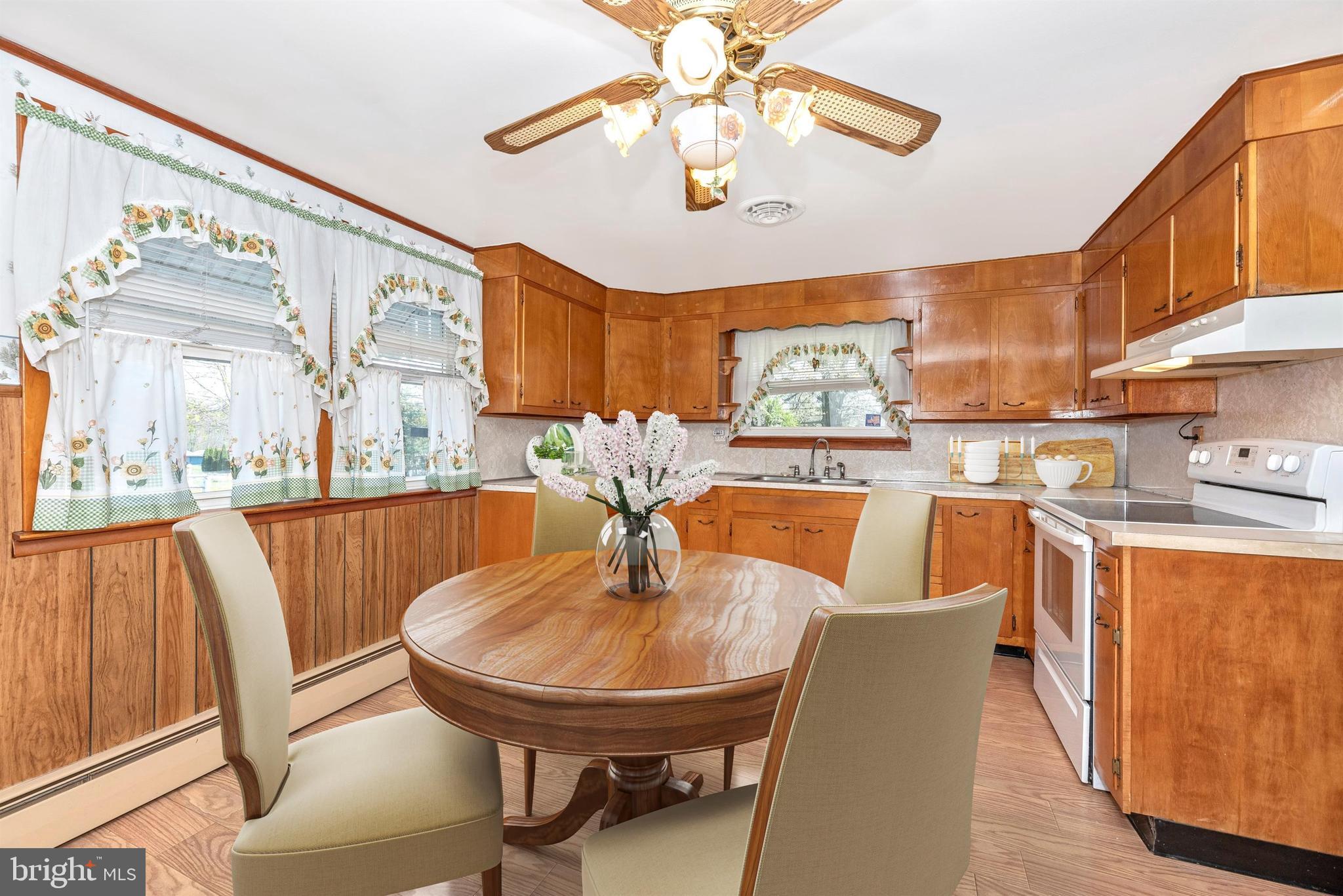 9250 Rocky Ridge Road Rocky Ridge, MD 21778 - Photo 11 of 67 a view of a dining room with furniture a chandelier and wooden floor