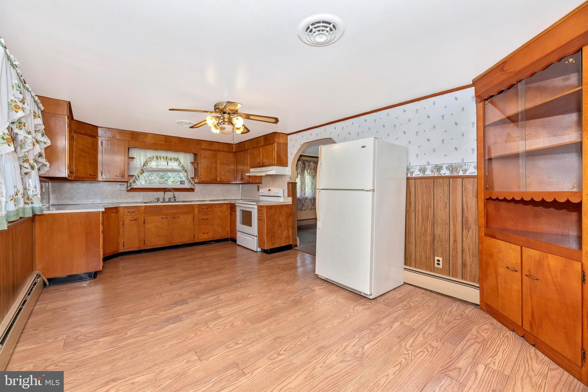 9250 Rocky Ridge Road Rocky Ridge, MD 21778 - Photo 16 of 67 a view of a kitchen with a refrigerator a microwave and a sink