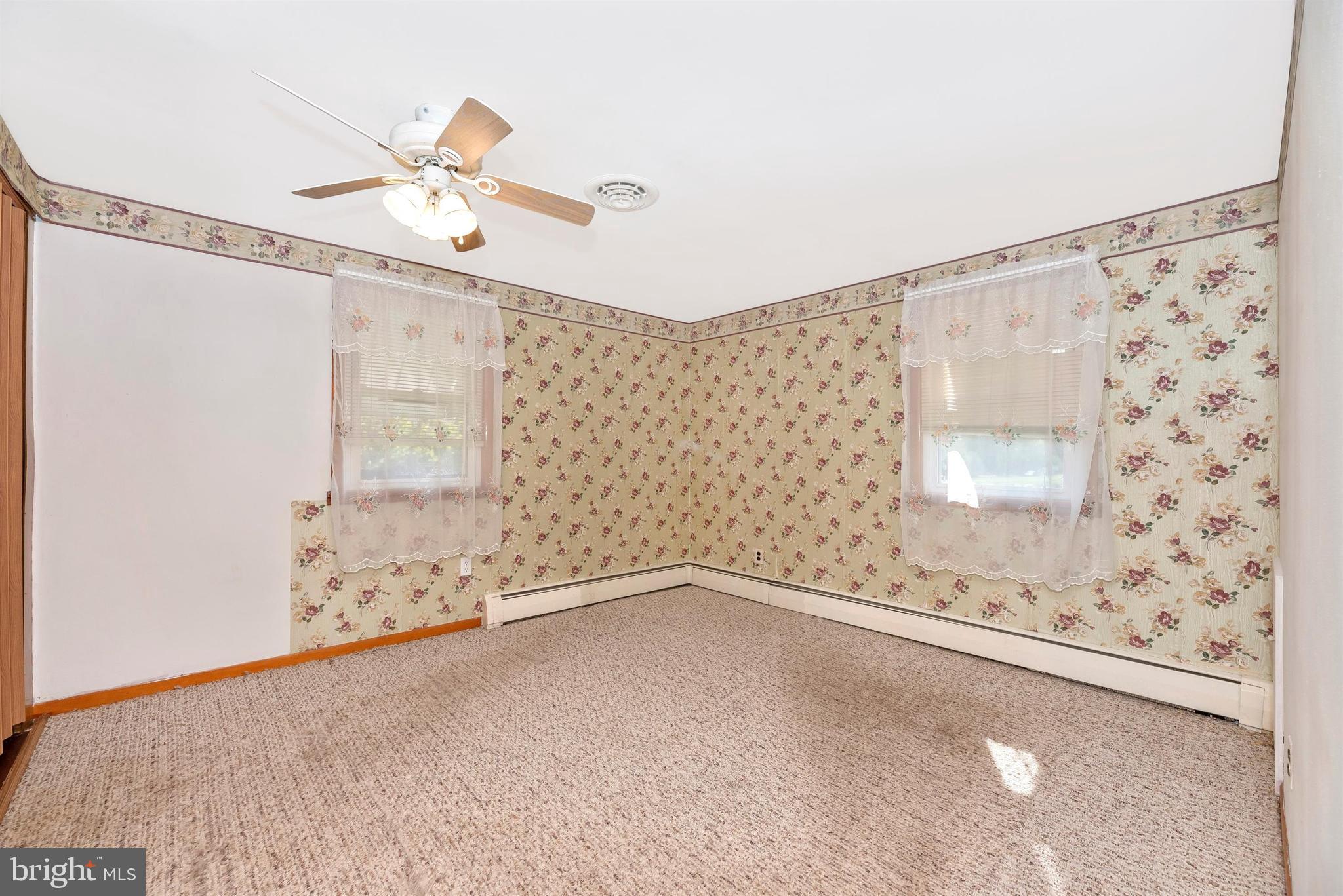 9250 Rocky Ridge Road Rocky Ridge, MD 21778 - Photo 22 of 67 a view of a room with window and ceiling fan