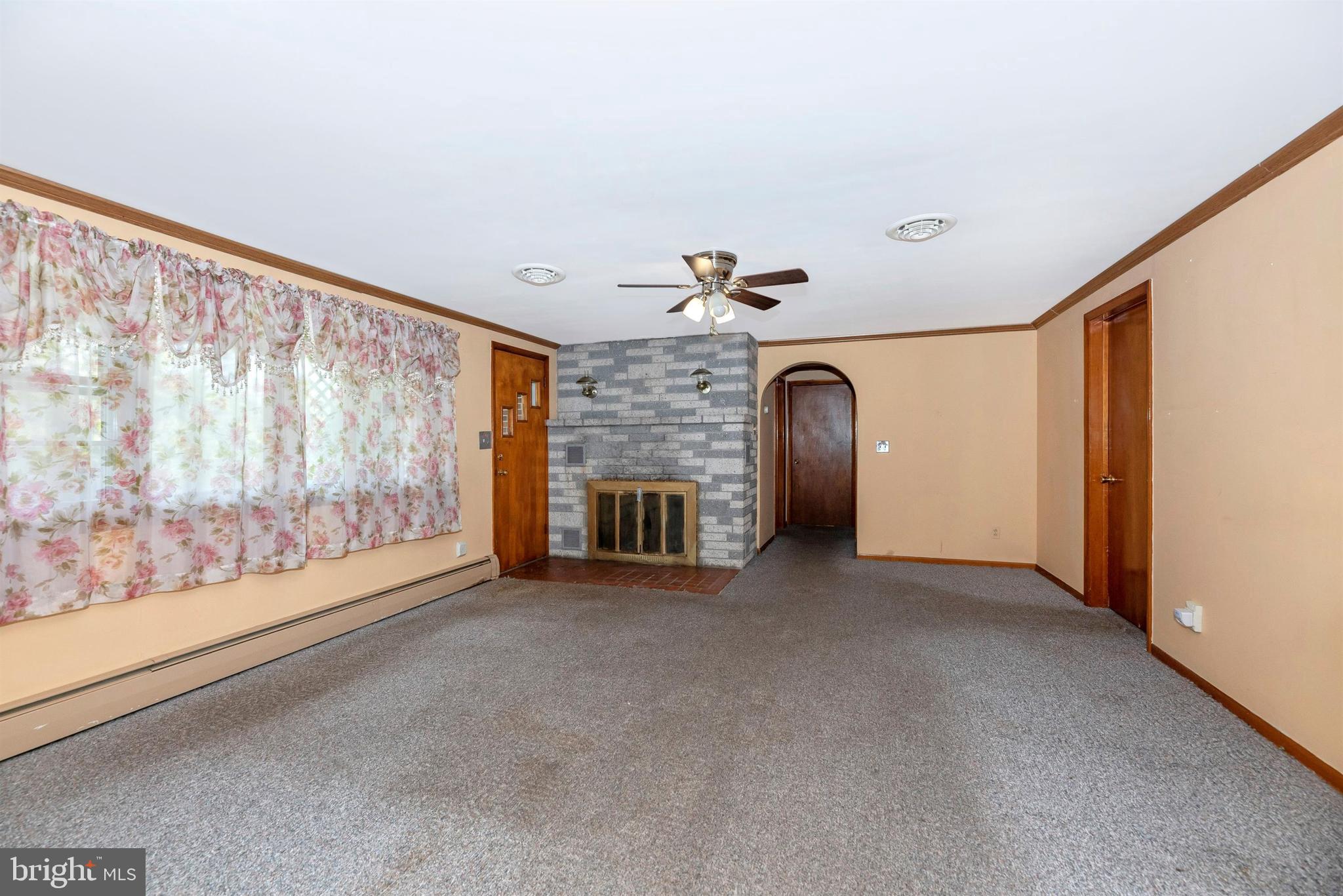 9250 Rocky Ridge Road Rocky Ridge, MD 21778 - Photo 5 of 67 a view of a livingroom with an empty space and a window