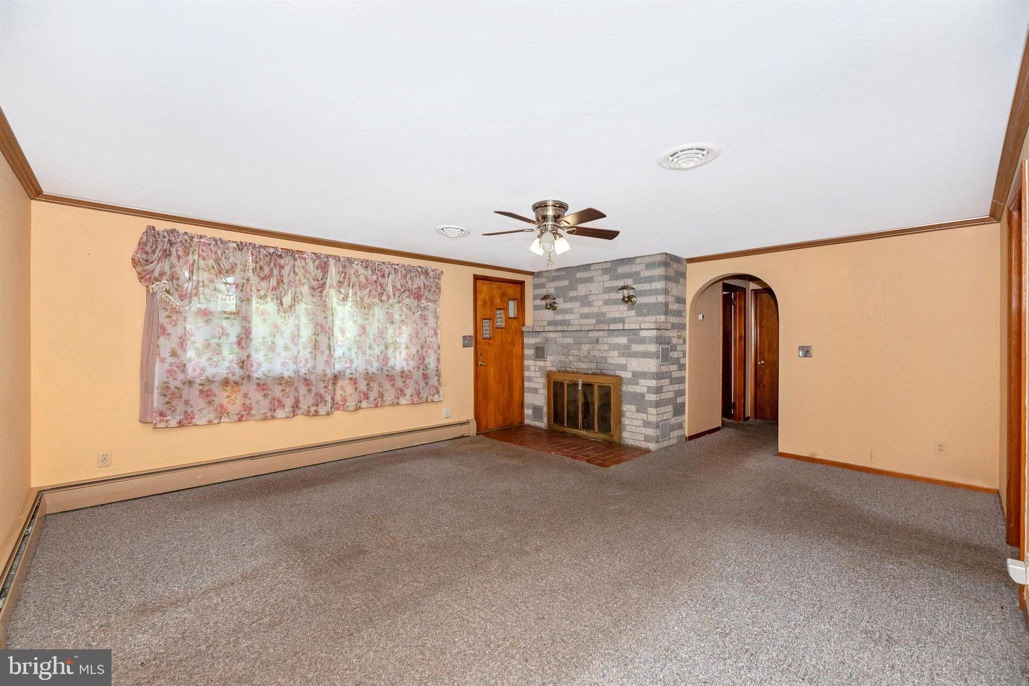 9250 Rocky Ridge Road Rocky Ridge, MD 21778 - Photo 6 of 67 a view of a livingroom with furniture and staircase