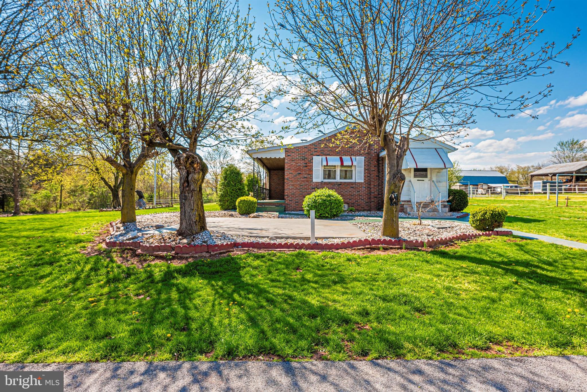 9250 Rocky Ridge Road Rocky Ridge, MD 21778 - Photo 58 of 67 a front view of a house with garden and trees