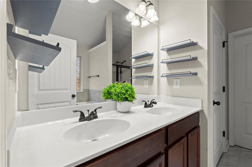 4940 Longview Run Decatur, GA 30035 - Photo 14 of 21 a bathroom with a sink and a mirror