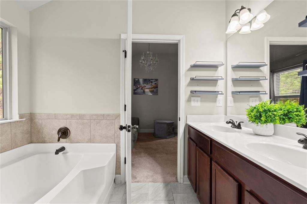 4940 Longview Run Decatur, GA 30035 - Photo 16 of 21 a bathroom with a sink and a bathtub