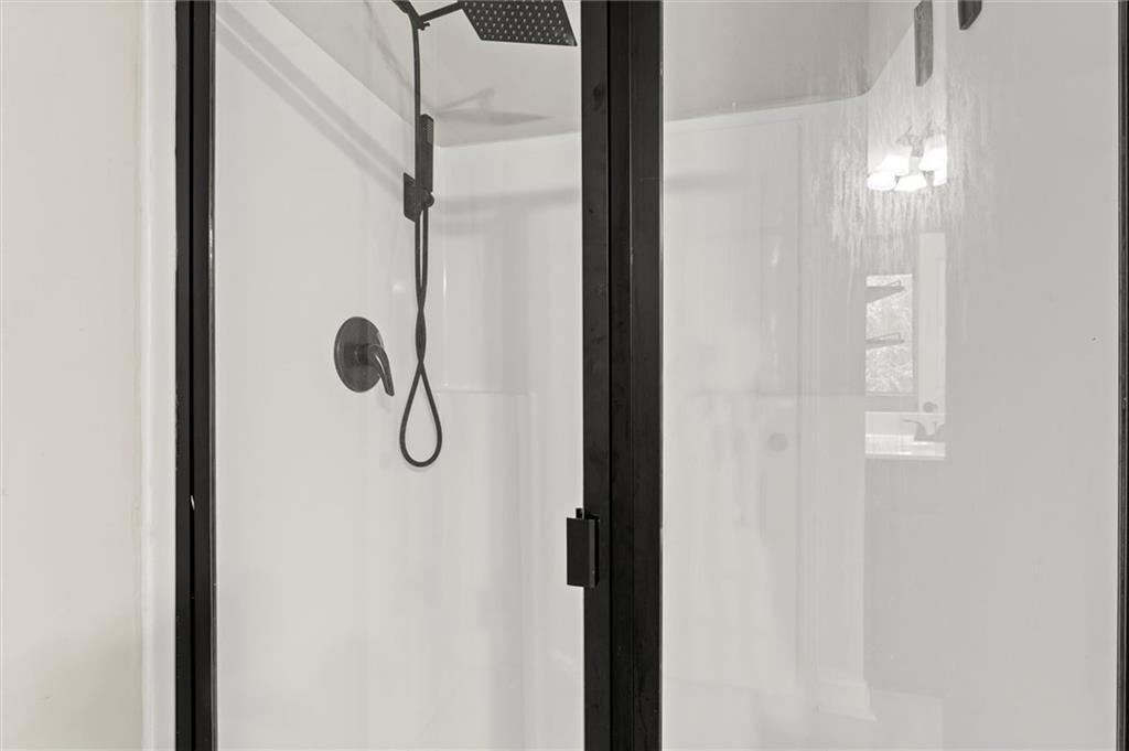 4940 Longview Run Decatur, GA 30035 - Photo 17 of 21 a bathroom with a glass shower door