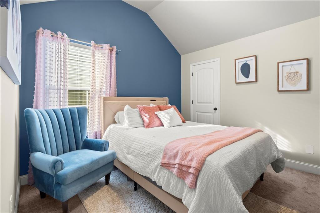 4940 Longview Run Decatur, GA 30035 - Photo 18 of 21 a bedroom with a bed couch and a window