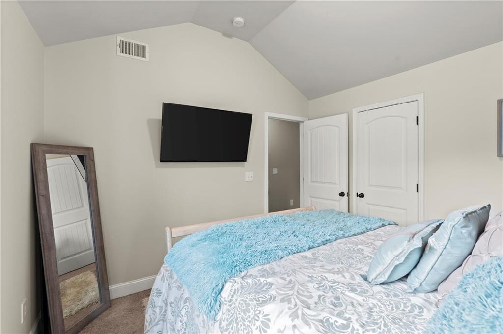 4940 Longview Run Decatur, GA 30035 - Photo 20 of 21 a bedroom with a bed and a flat screen tv