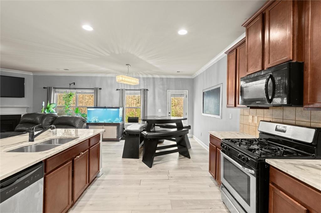 4940 Longview Run Decatur, GA 30035 - Photo 3 of 21 a kitchen with stainless steel appliances granite countertop a sink stove and refrigerator