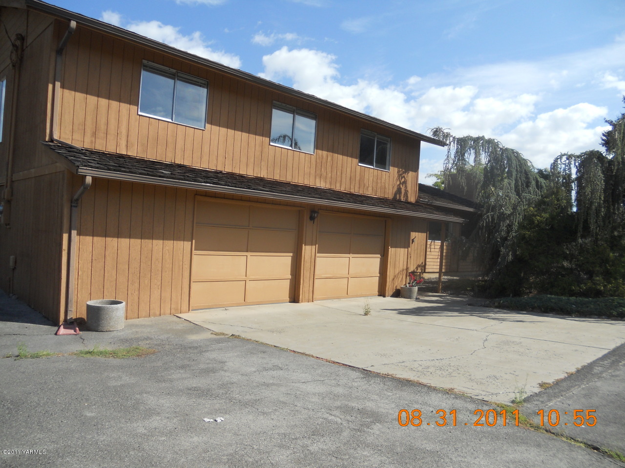 a front view of a house with a garage