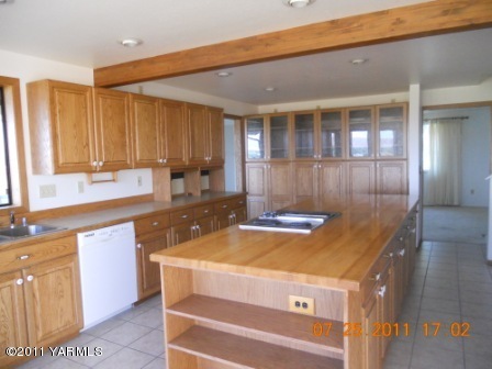 715 Meadowbrook Road Yakima, WA 98903 - Photo 6 of 7 a view of a kitchen with a sink and cabinets