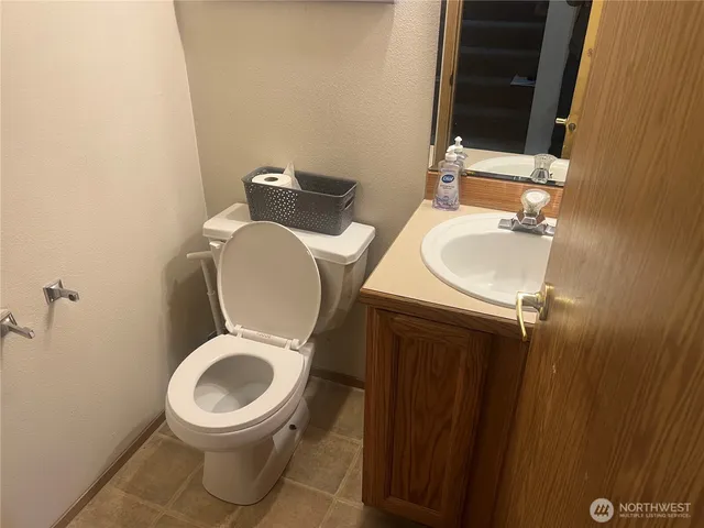 a bathroom with a toilet and a sink